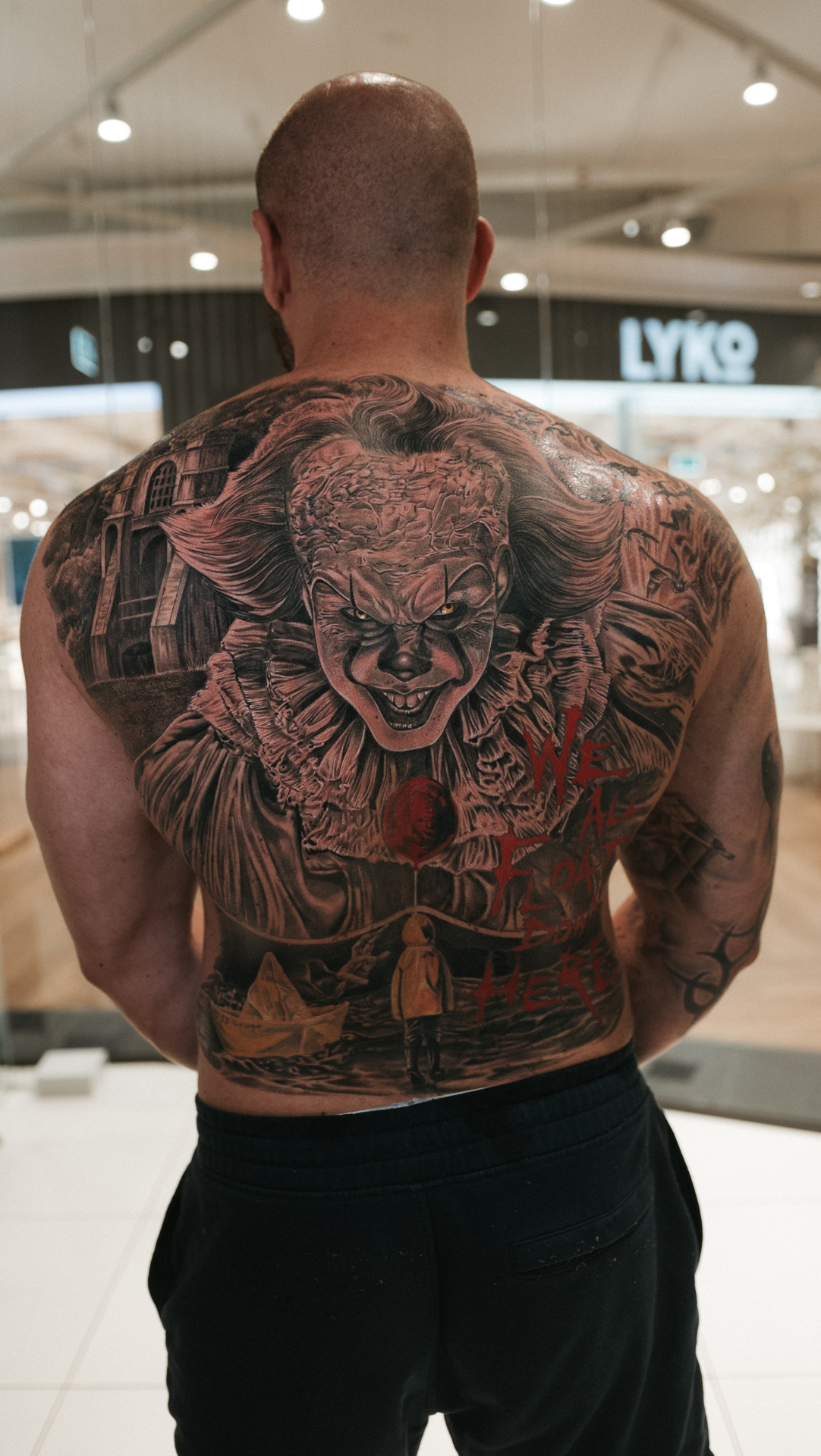 Hyper realism Pennywise backpiece tattoo